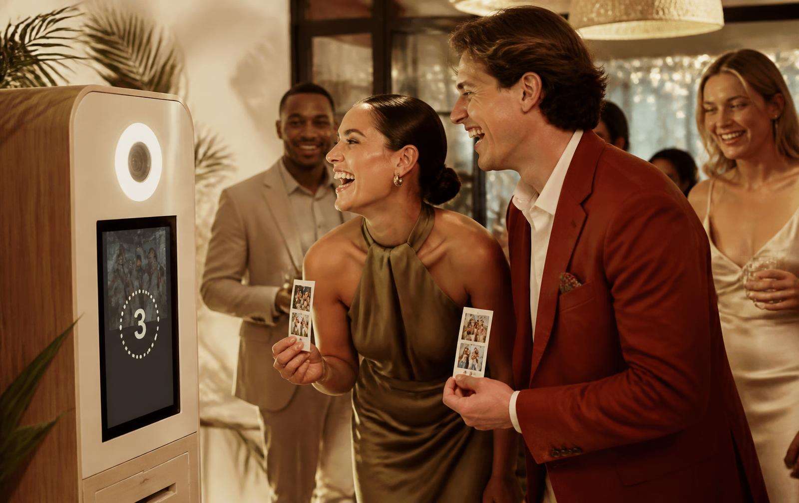 Guests at a photo booth at a party